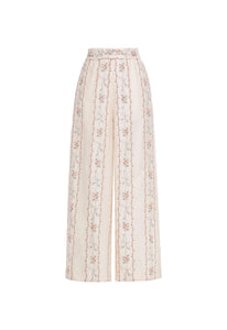 Front view of Tota Navegante Trouser showcasing high-rise wide-leg silhouette and floral embroidery with white background