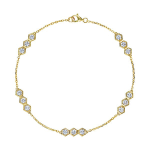 The Serpentine Station Bracelet with Hexagon Diamond Trios is an 18k gold bracelet featuring small hexagonal clusters of round brilliant diamonds, evenly spaced along a fine chain with a lobster claw clasp.
