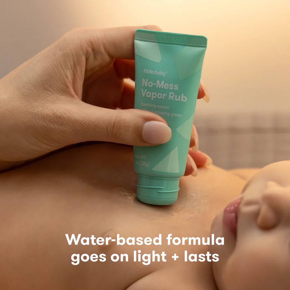 Front view of No-Mess Vapor Rub tube showcasing its built-in applicator over a baby with water-based formula text