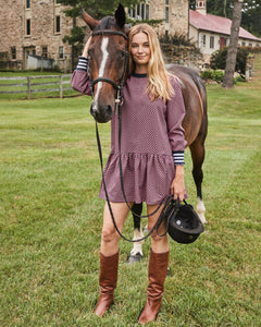 Model is wearing the Vine Dress in Navy/ Cherry Stars.