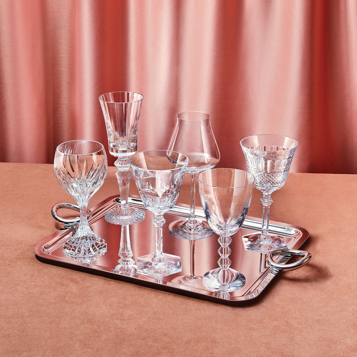 Front view of Box of Wine, Set of 6 Glasses showcasing varied crystal designs on a mirrored tray