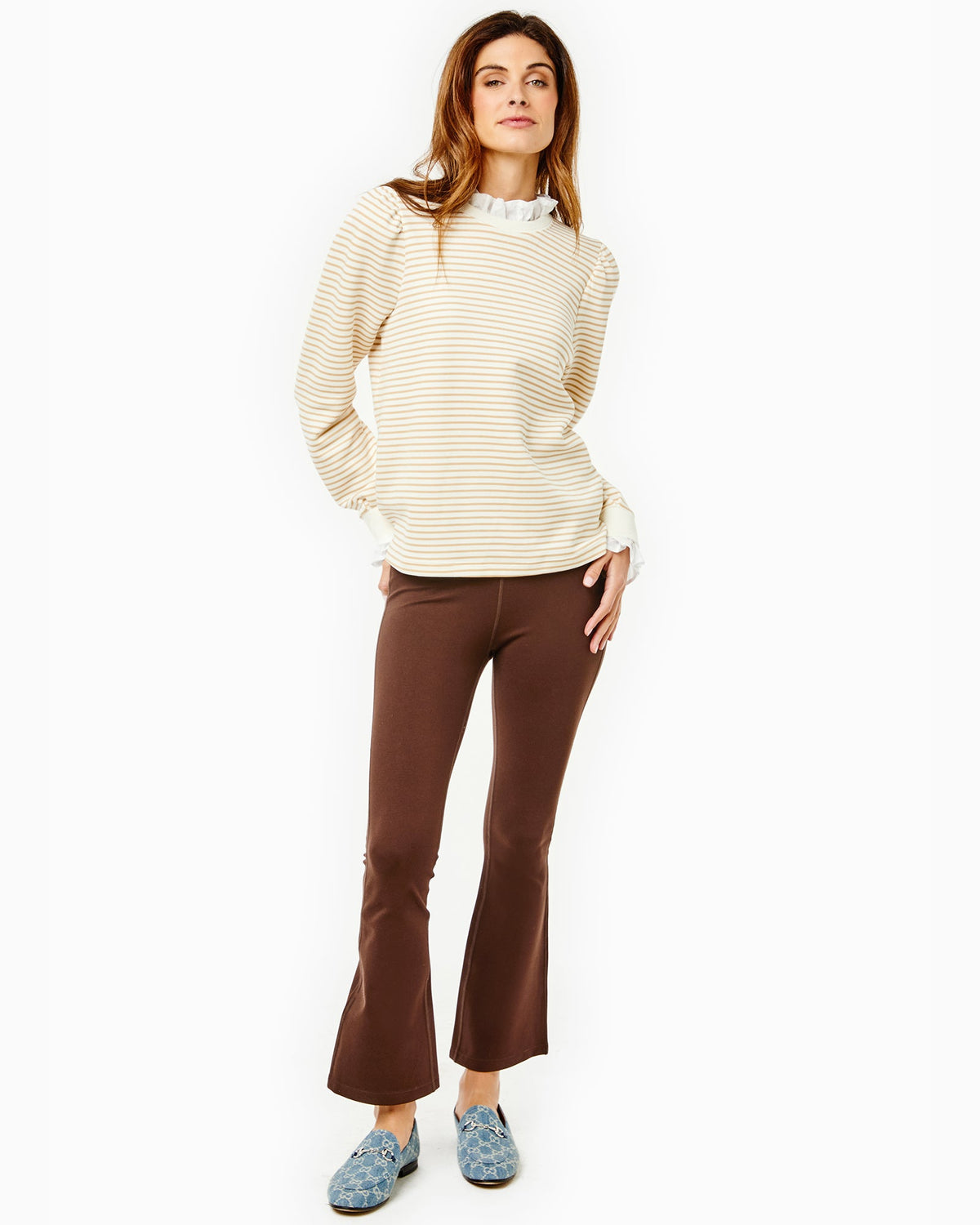 Model is wearing the Ziggy Top in Cream/ Camel Stripe with the University Flare Pants in Chocolate