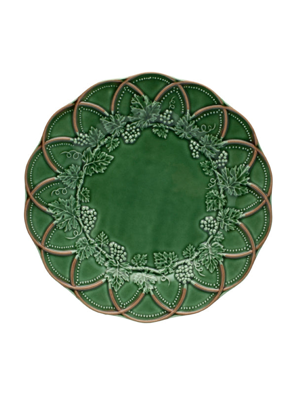 Front view of Woods dinner plate showcasing a deep green and brown floral illustration with a scalloped edge