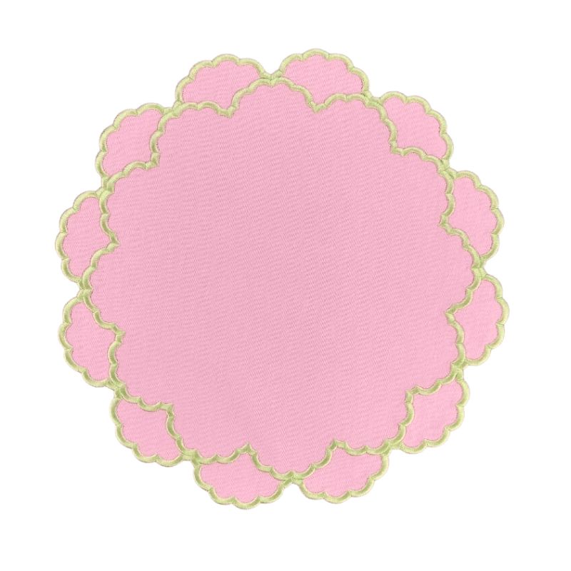 pink scalloped placemat with green embroidery with coordinating fringe napkin