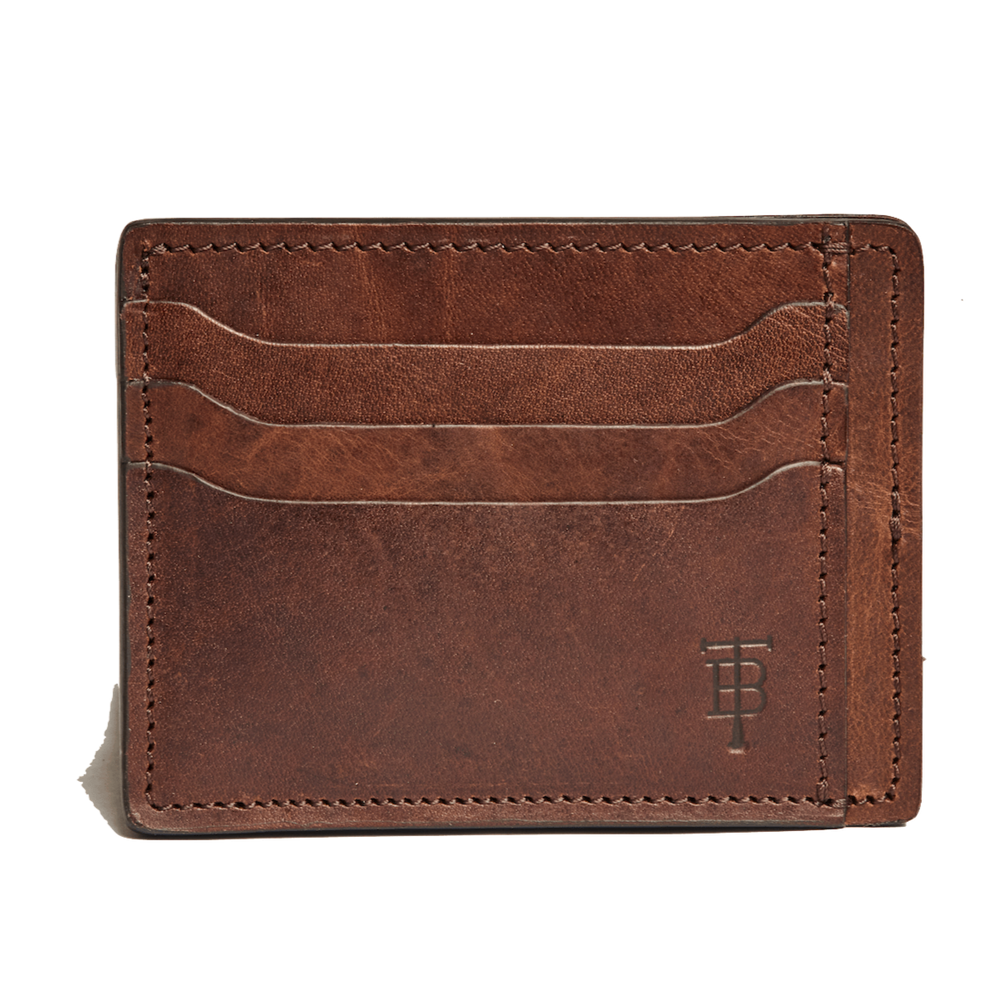 Front view of Slim Wallet in oak showing three exterior card slots, stitched edges, and embossed logo on white background