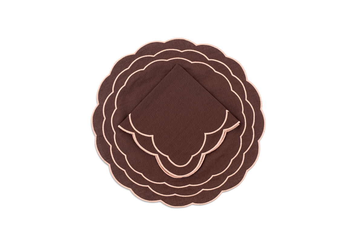 Top view of Sofia linen brown placemat showcasing blooming dahlia hand embroidery on a white background