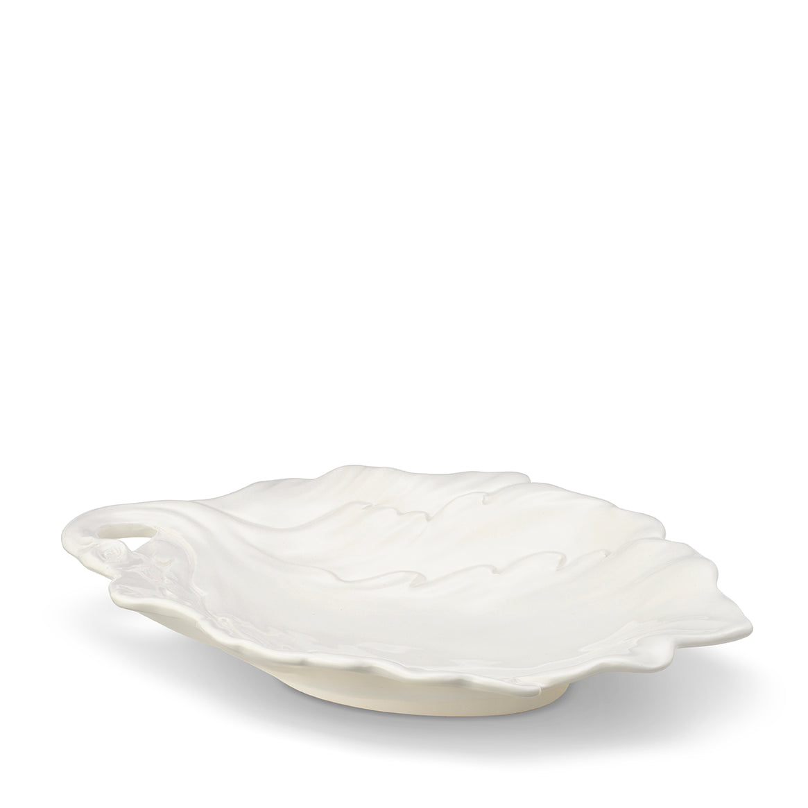 Three-quarter view of the cream Mariella Leaf Dish showcasing sculpted leaf details on a white background