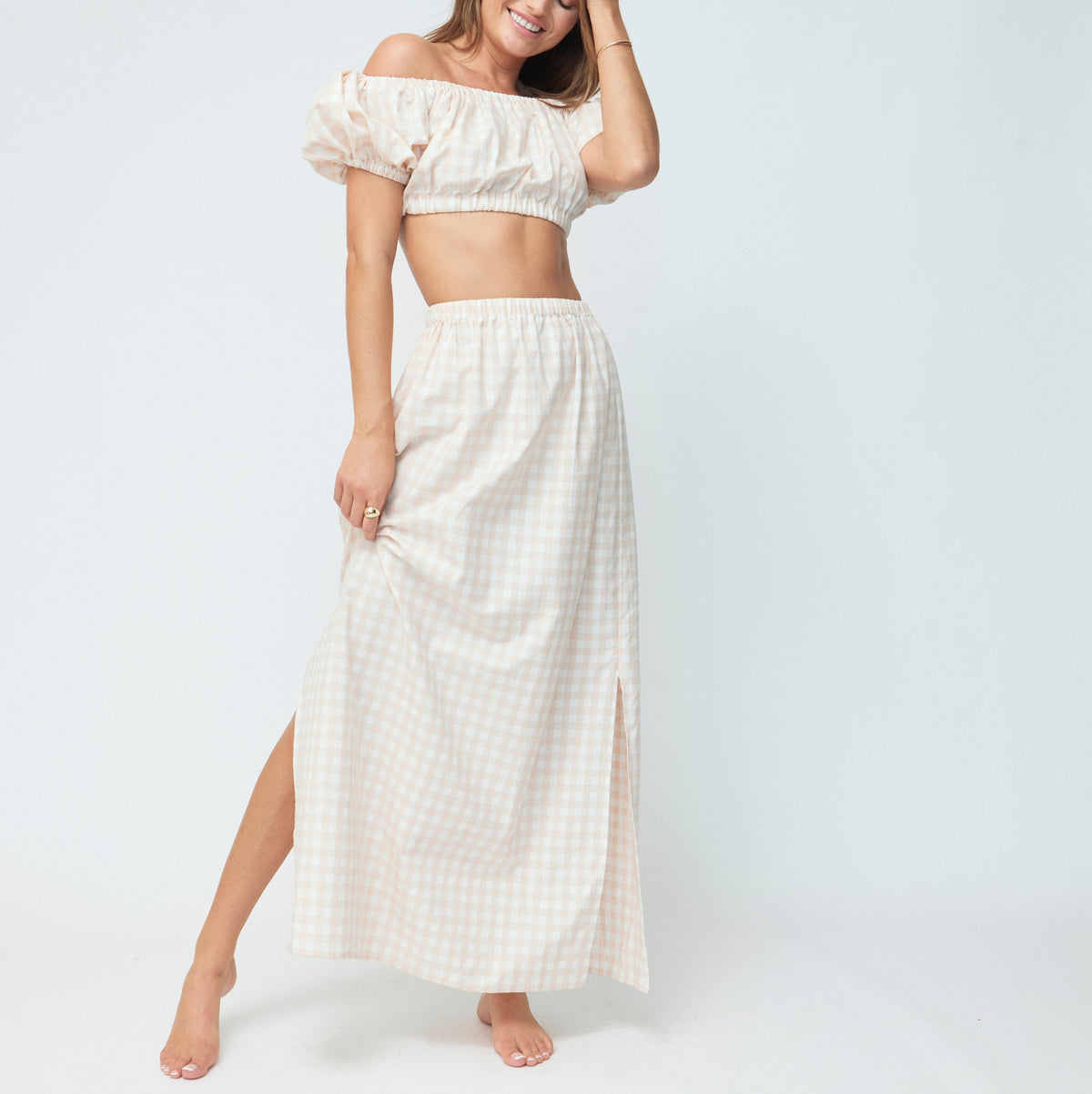 Front view of The Stella Set in Blush Gingham showcasing its cropped top and midi skirt on a model against a light background