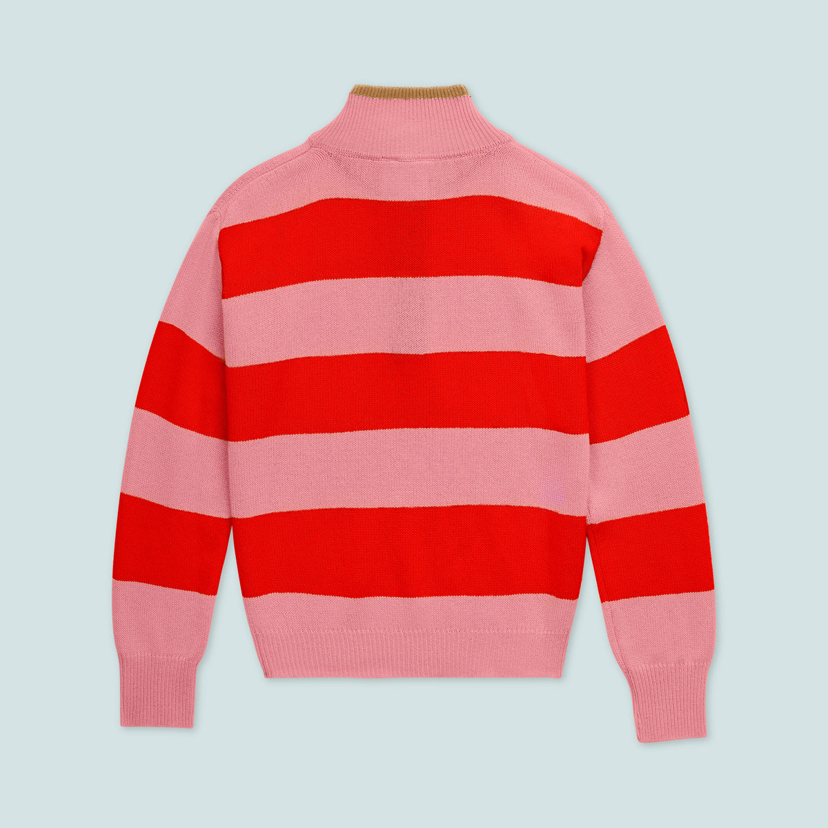 Flat lay of The Diana Sweater in Colorblock Pink and Red showcasing wide pink and red stripes and ribbed trim on a pale blue background