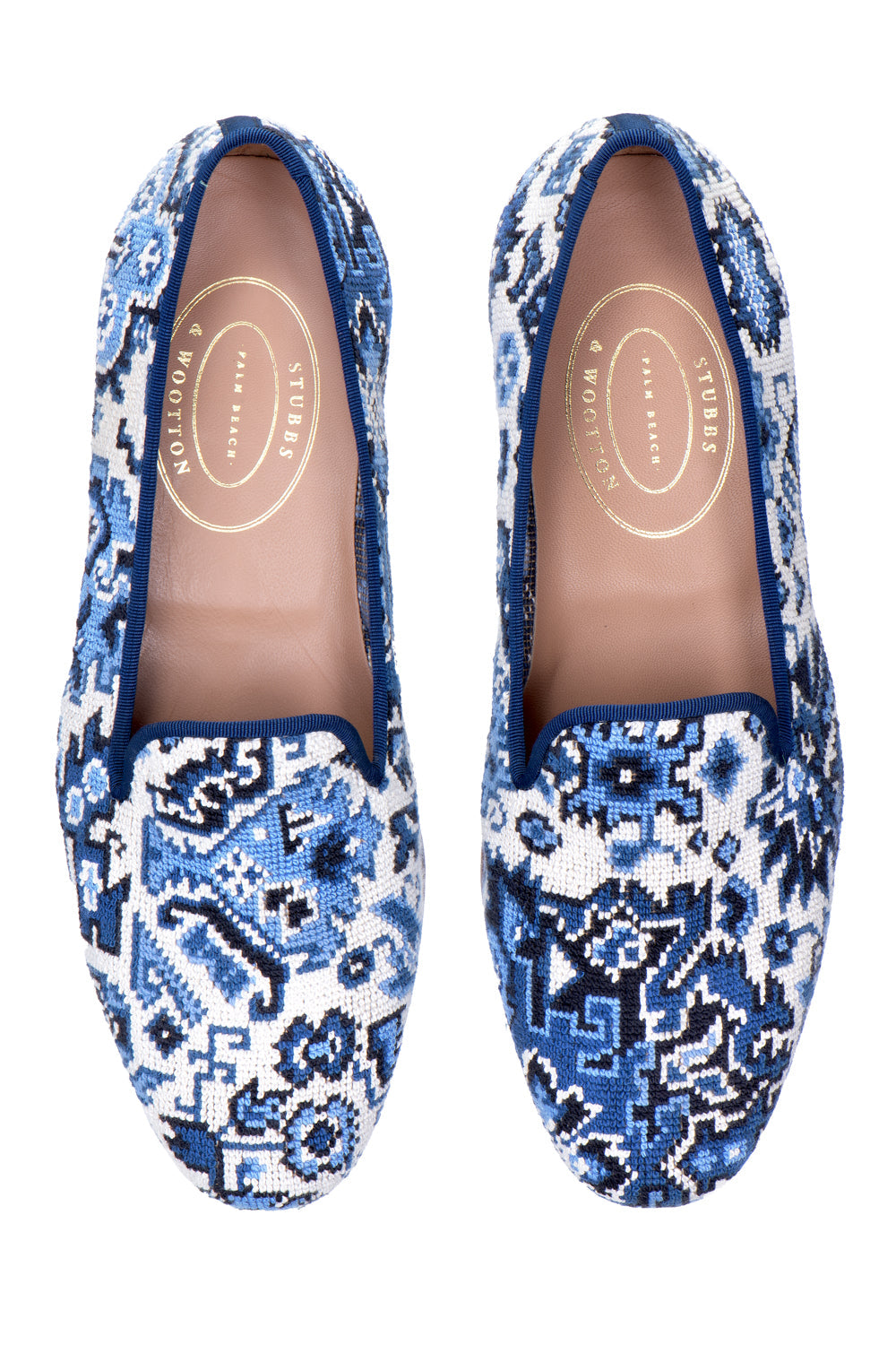 Top view of Heriz slipper in Lapis showcasing blue and white patterned uppers on a white background