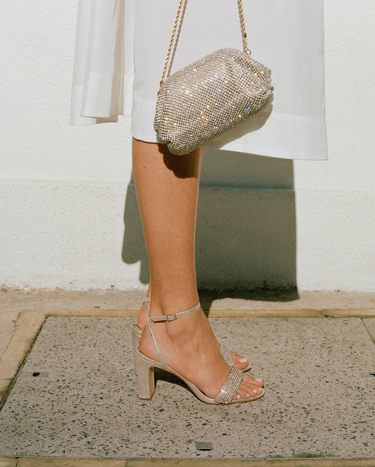 Side view of Shay Sandal in Cappuccino Suede Rhinestones with rhinestone straps and 3.25 inch heel on a model