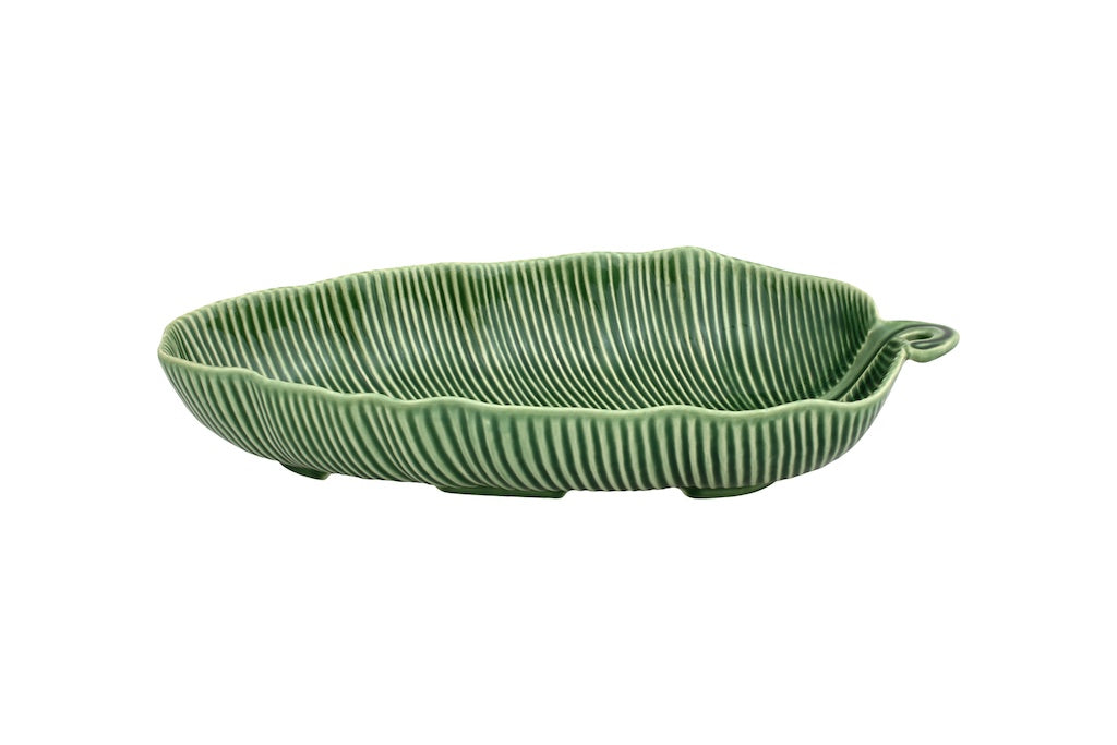Side view of Leaves salad bowl showcasing leaf shape, ribbed texture, and small handle in green glaze on white background