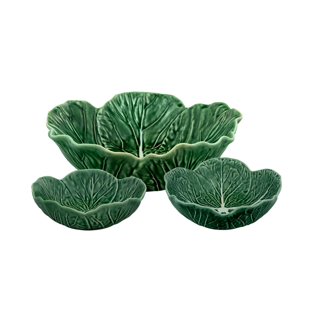 Front view of three green earthenware cabbage nesting bowls showing embossed leaf texture on white background