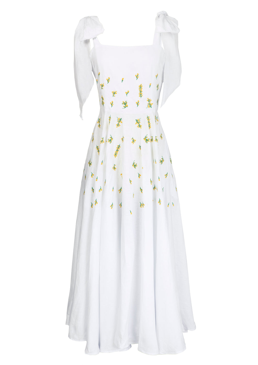 Front view of Mimose Dress with self-tie shoulder straps, yellow floral embroidery and flowing maxi skirt on white backdrop