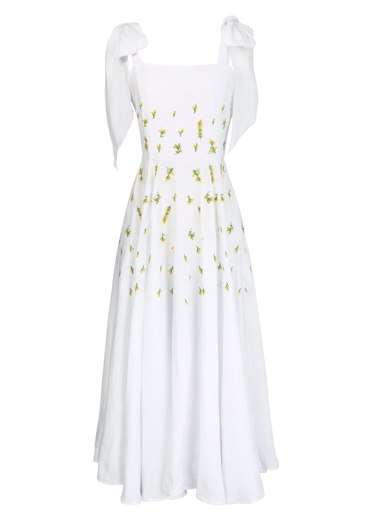 Front view of Mimose Dress with self-tie shoulder straps, yellow floral embroidery and flowing maxi skirt on white backdrop