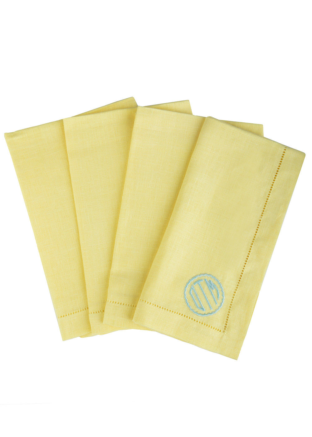Monogram Dinner Napkin in Canary, set of 4 showcasing scallop circle monogram and hemstitching on white background