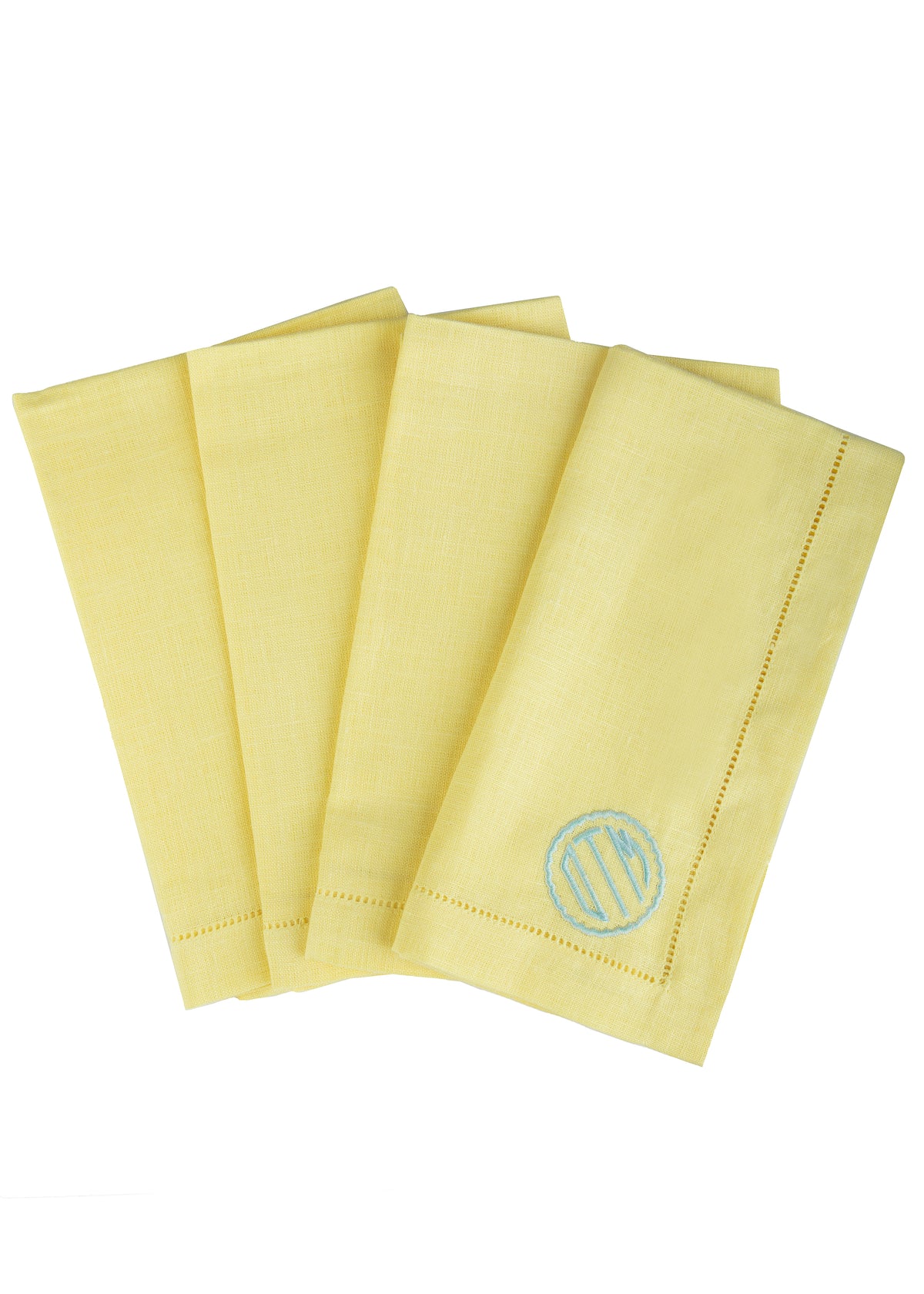 Monogram Dinner Napkin in Canary, set of 4 showcasing scallop circle monogram and hemstitching on white background