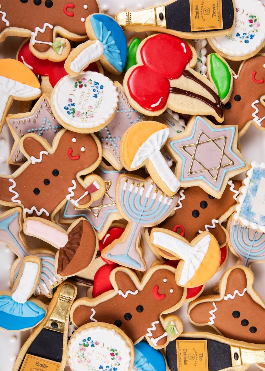 Top-down view of Magic Mushroom Sugar Cookies: decorated mushroom and holiday shapes with colorful royal icing