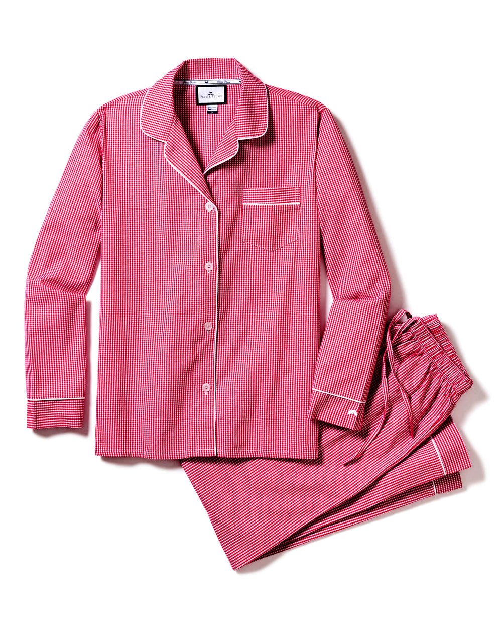 Flat lay of women’s red mini gingham pajama set with white piping, button-front top and drawstring pants