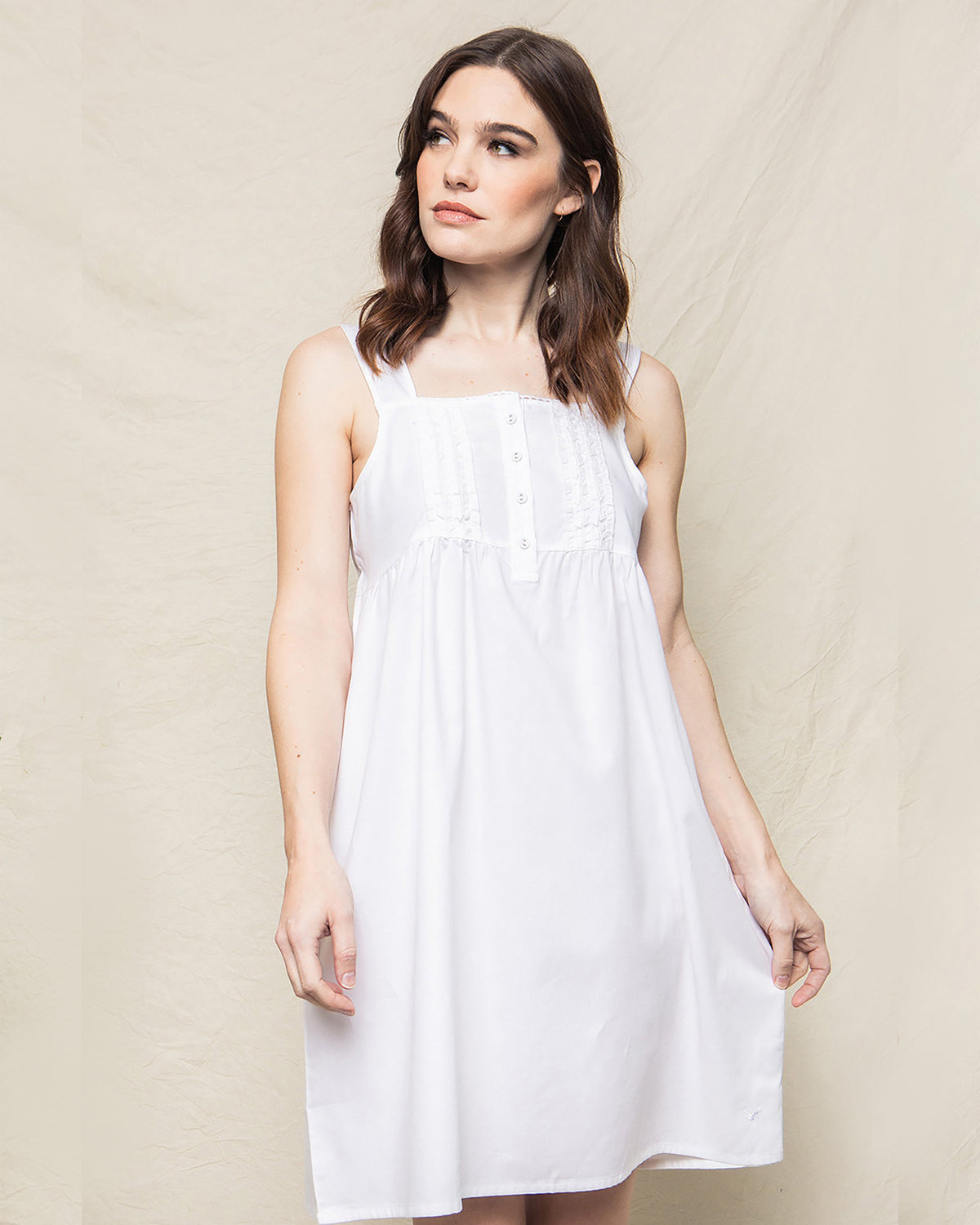 Front view of Women’s White Charlotte Nightgown showcasing lace trim, button placket, and wide hem with a neutral backdrop