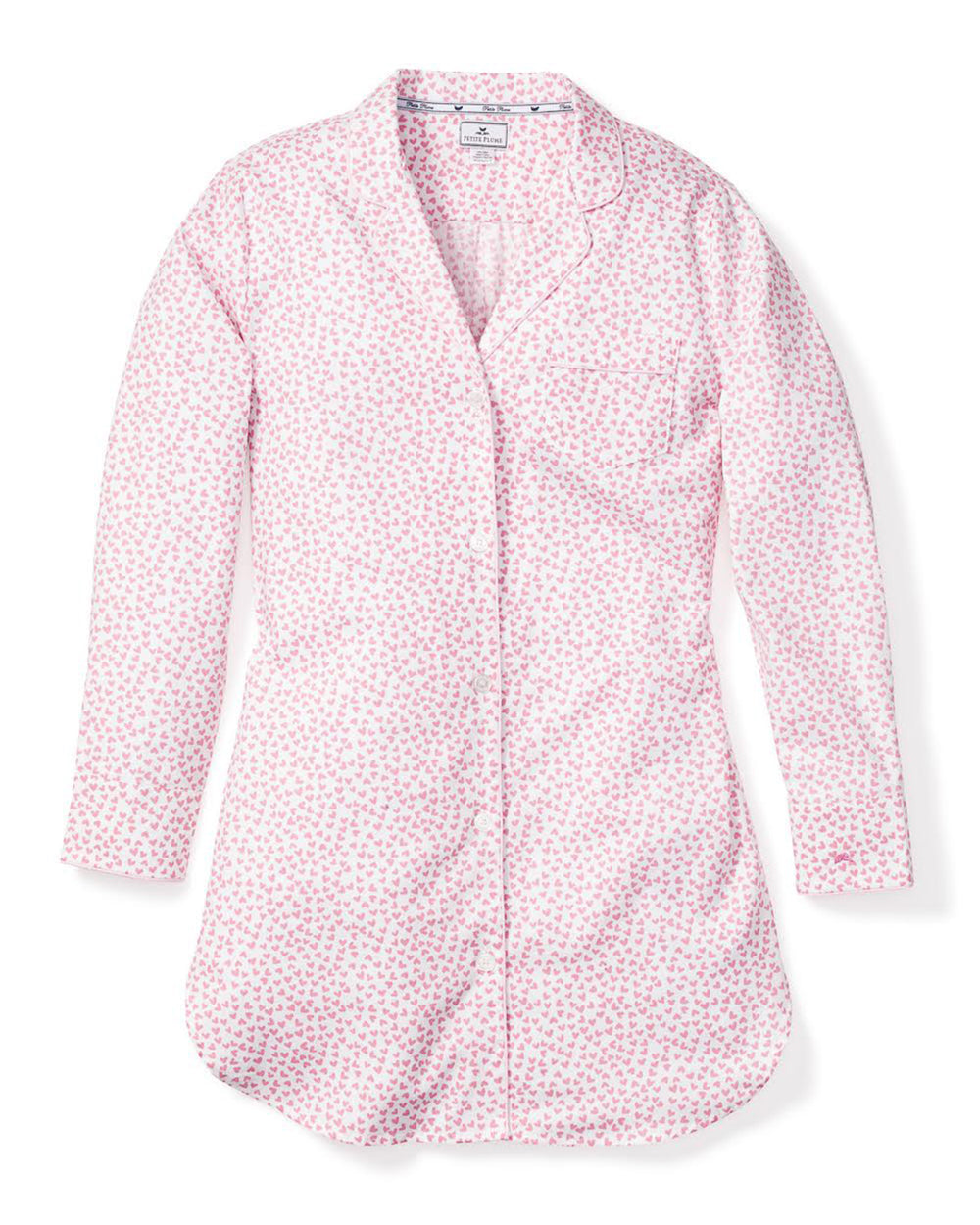 Flat lay of Sweethearts nightshirt showcasing pink all-over heart print, piped collar, and pearl buttons on white background