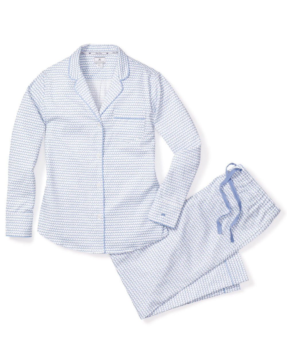 Flat lay of Women’s La Mer pajama set showcasing light blue scallop print, contrast blue piping, and drawstring waist on white background