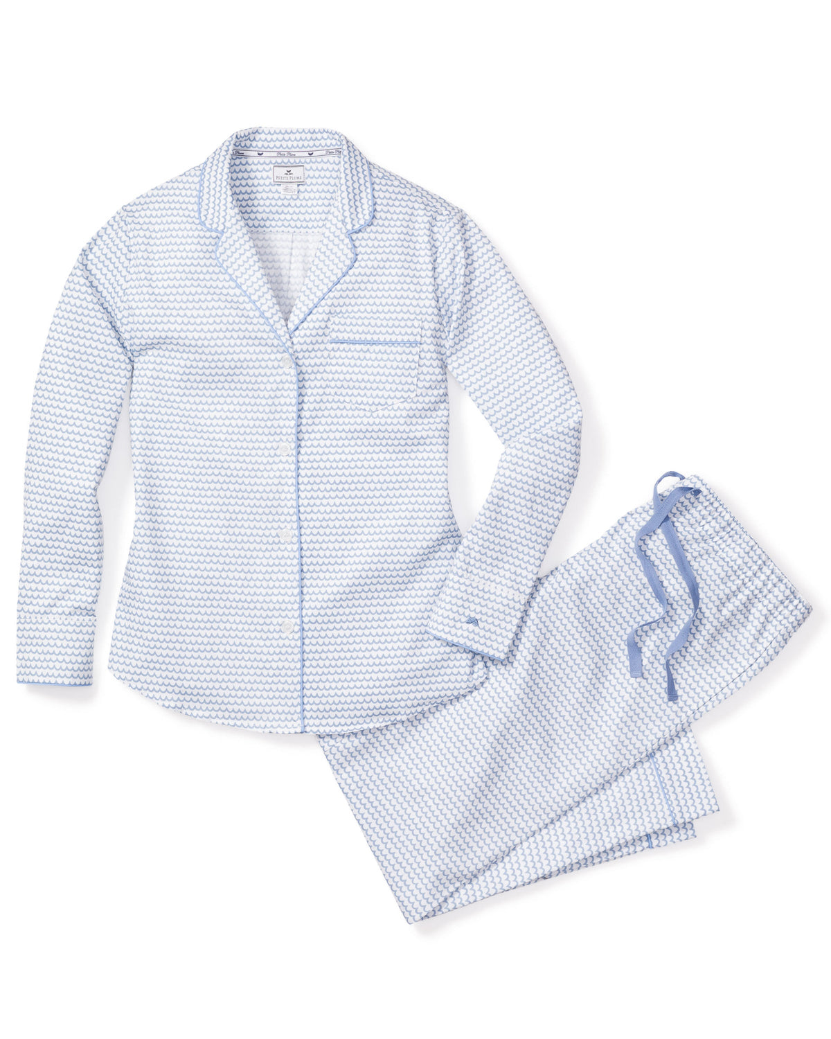 Flat lay of Women’s La Mer pajama set showcasing light blue scallop print, contrast blue piping, and drawstring waist on white background