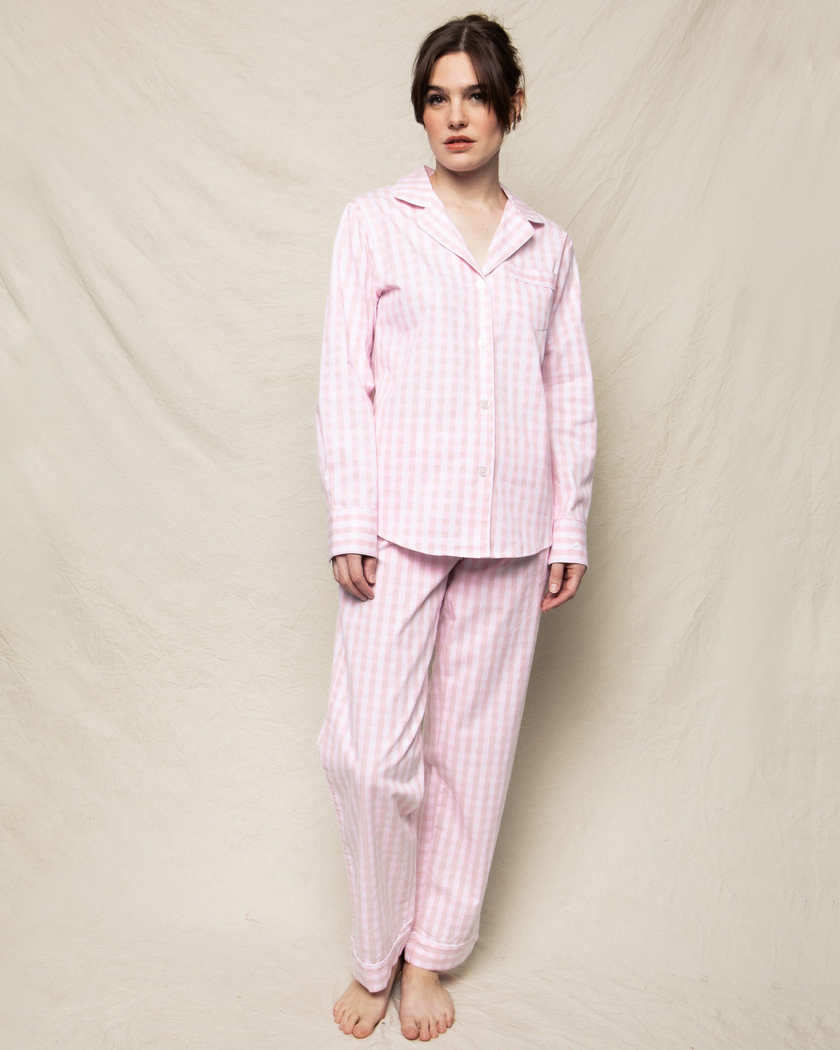 Front view of Women’s Pink Gingham Pajama Set showing button-front shirt and pants on a model against beige backdrop