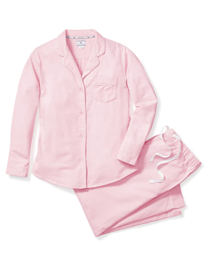 Flat lay of Women’s Pink Flannel Pajama Set with long sleeves, button front, chest pocket, and drawstring pants