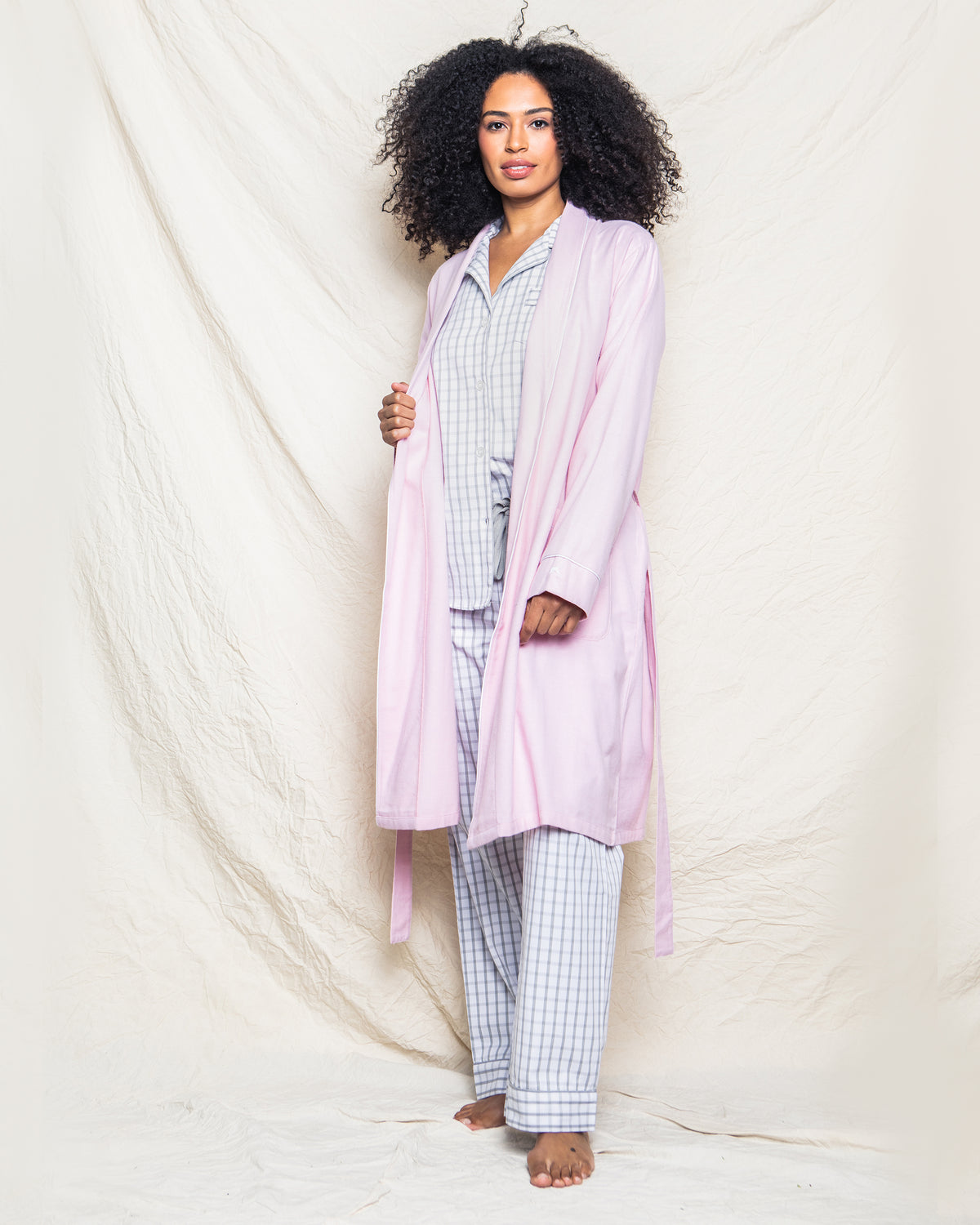 Front view of Women’s Pink Flannel Robe showcasing long sleeves, shawl collar, belt, and front pockets on a model