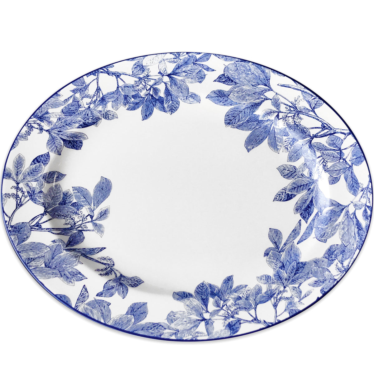 Top view of Blue Arbor Large Oval Rimmed Platter showcasing blue leafy branches on white porcelain