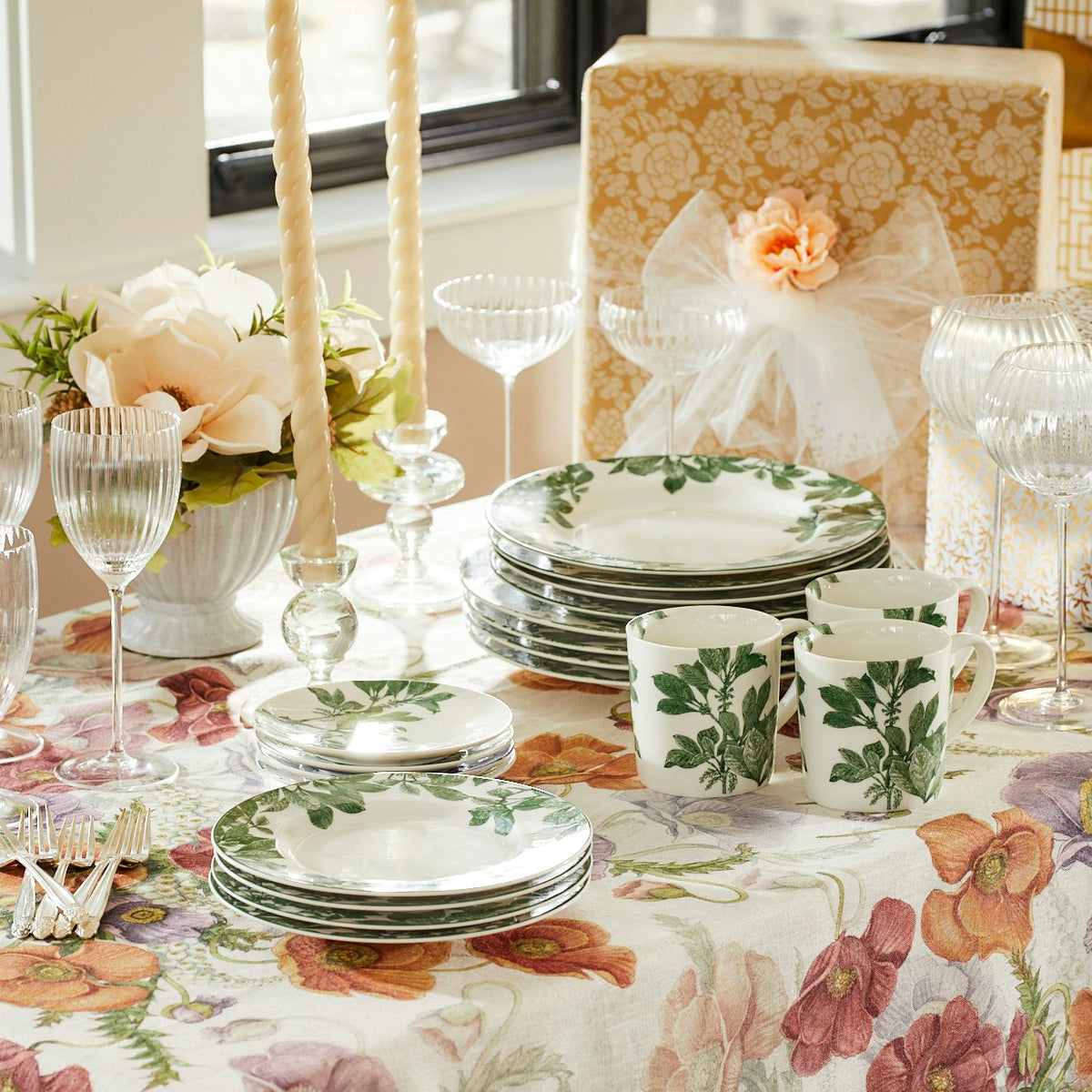 A set of Arbor Green Canapé Plates by Caskata on the table.