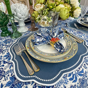 Autumn blue placemat with white embroidery, blue floral napkin and tablecloth and leaf napkin ring