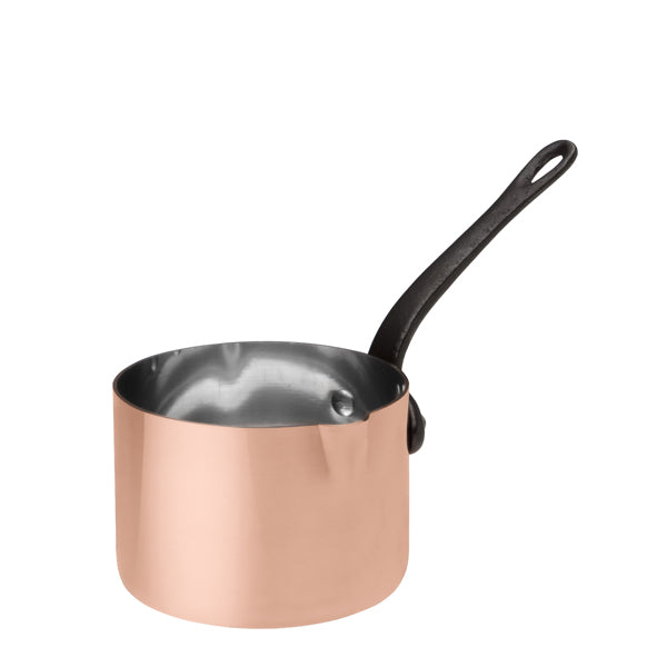 Three-quarter view of Baumalu Saucier showcasing pure copper body, tin-lined pan, and cast-iron handle on white background