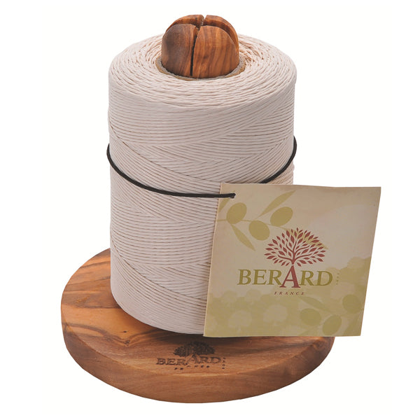 Angled view of Olive Wood Twine Holder with Twine showcasing a white twine roll on a carved olive wood base with white background