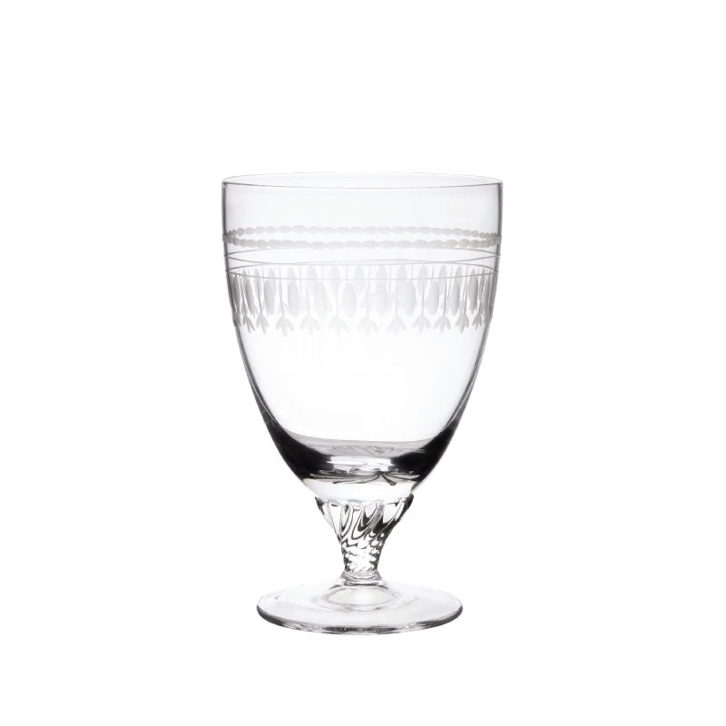 Front view of crystal bistro glass showing engraved oval pattern and short twisted stem on white background