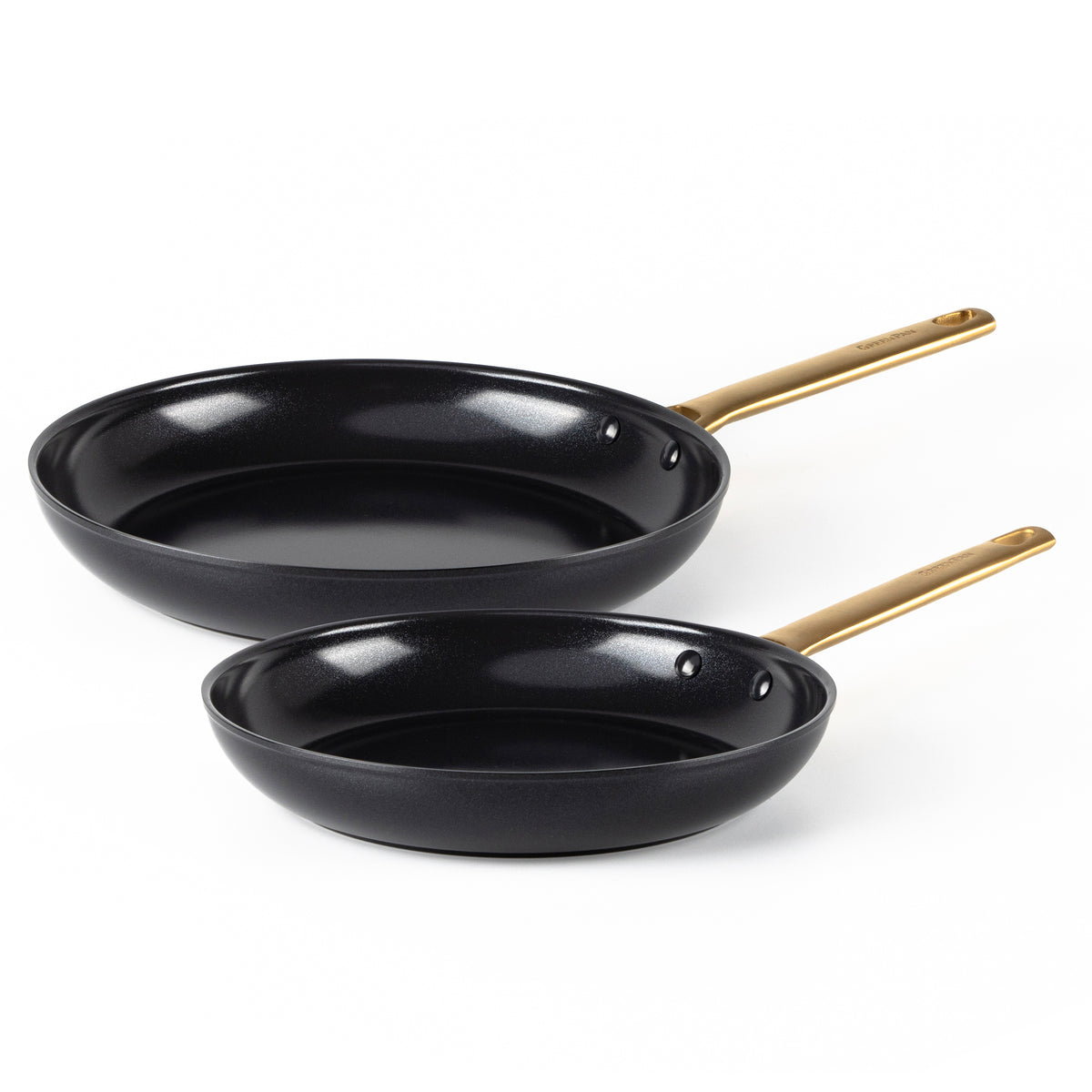 Angled view of Reserve Collection Cookware 10-Piece Set in Black showcasing two black frying pans with gold handles