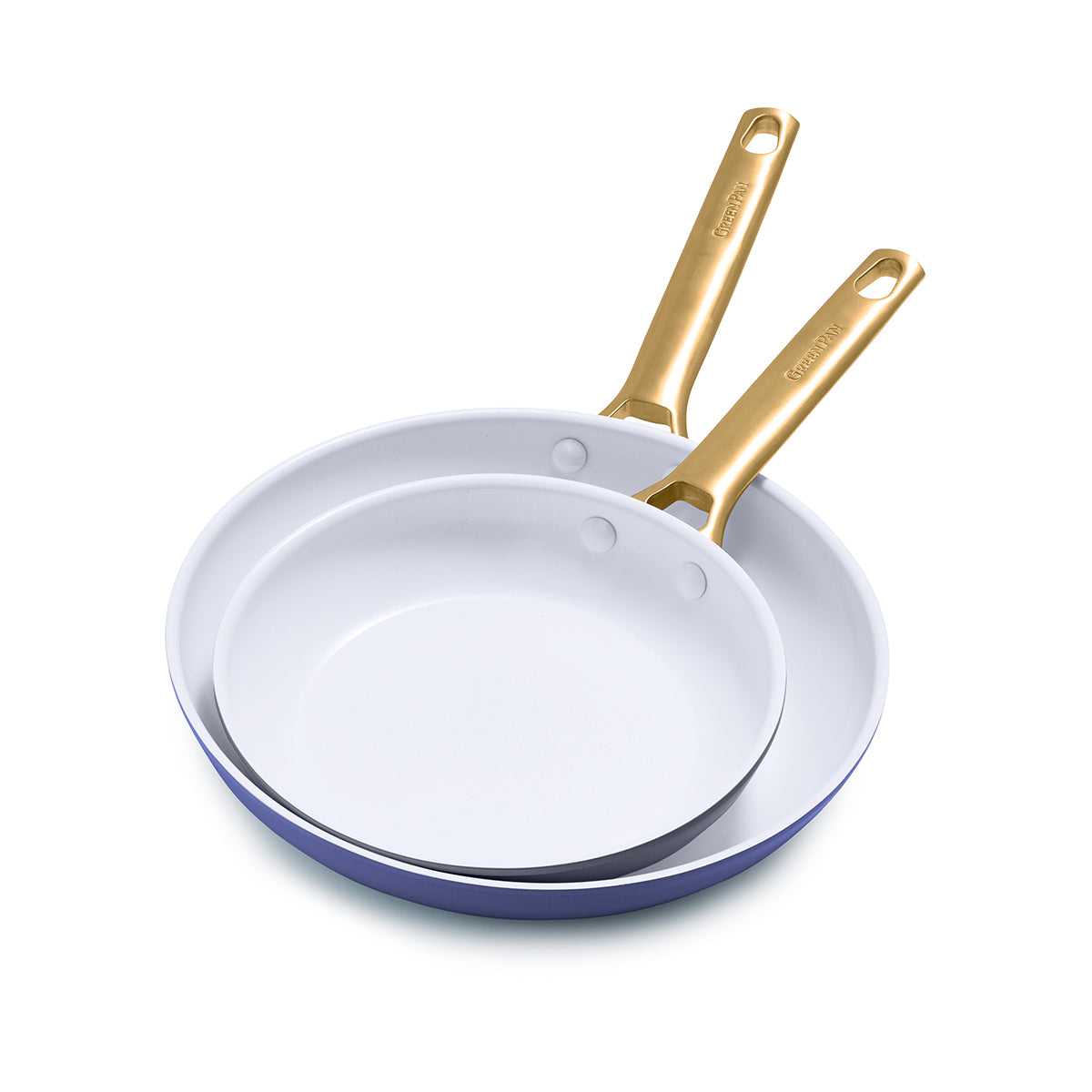Angled view of Reserve Collection 2-Piece Fry Pan Set in Dark Blue showcasing white interiors and gold handles