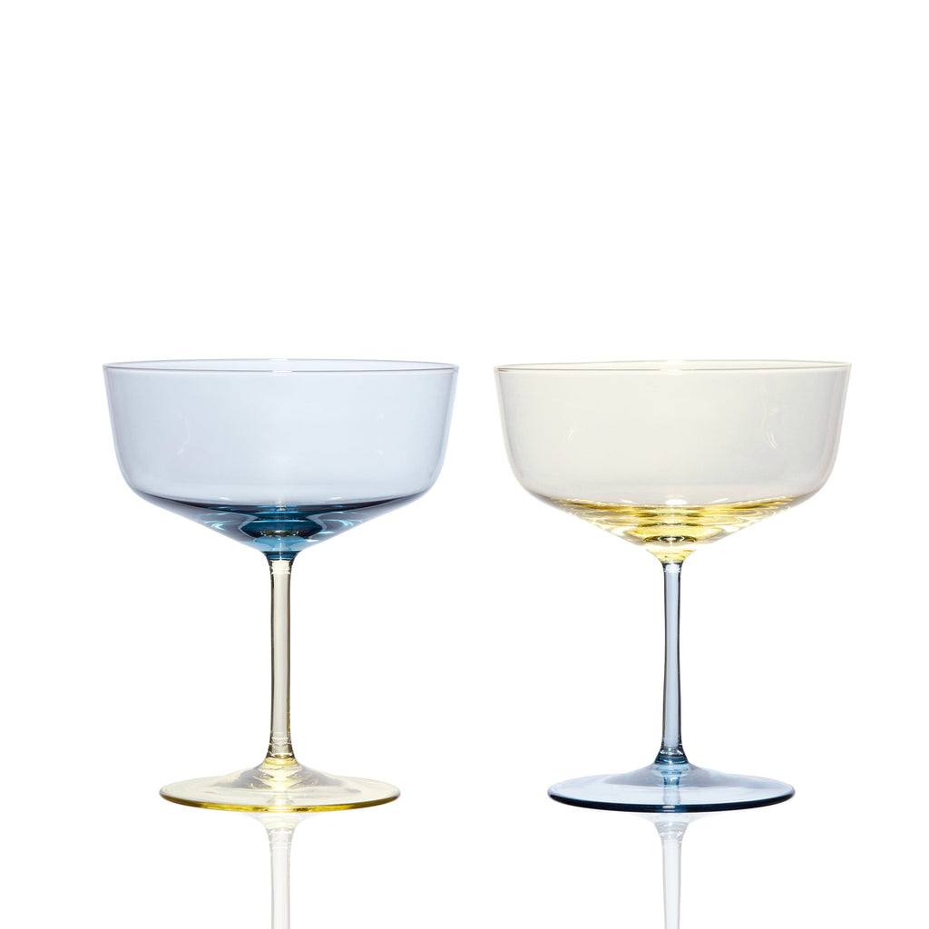 Celia mismatched ocean blue and citrine yellow crystal coupe cocktail glasses from Caskata.