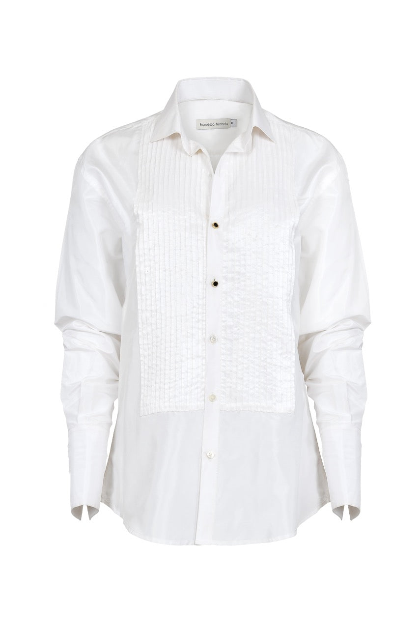 Front view of Classic Tuxedo Shirt in silk taffeta showcasing pleated bib front and cufflink piercings on white background