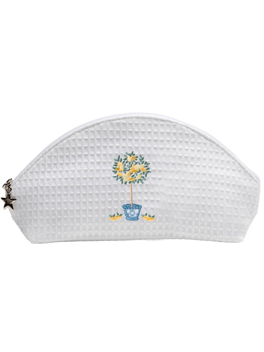 Front view of white waffle-weave cosmetic bag showcasing embroidered lemon topiary and star zipper charm on a white background