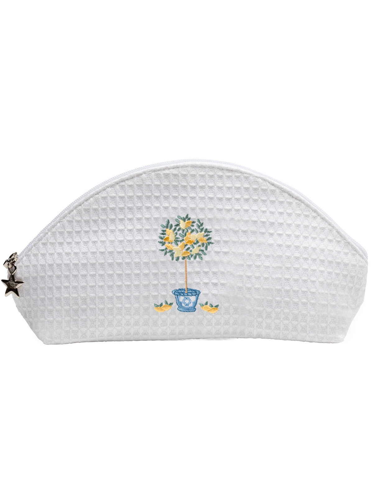 Front view of white waffle-weave cosmetic bag showcasing embroidered lemon topiary and star zipper charm on a white background
