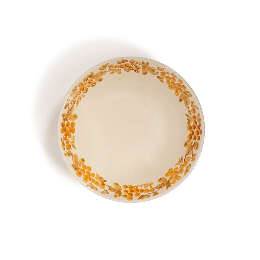 Top view of large Vine Bowl showing hand-painted mustard vine border on cream ceramic against white background