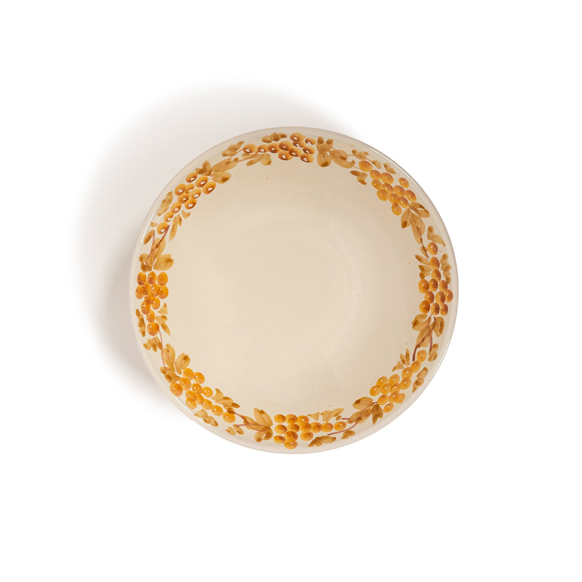 Top view of large Vine Bowl showing hand-painted mustard vine border on cream ceramic against white background