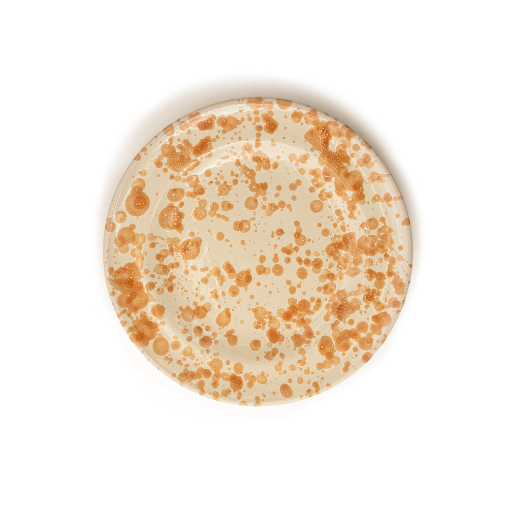 Top view of Splatter side plate showing tan and ivory ceramic with orange splatter pattern on white background
