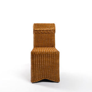Front Photo of Sharland-England's Letty slipper chair, hand-crafted from 100% natural rattan and featuring undulating lines and feminine silhouette