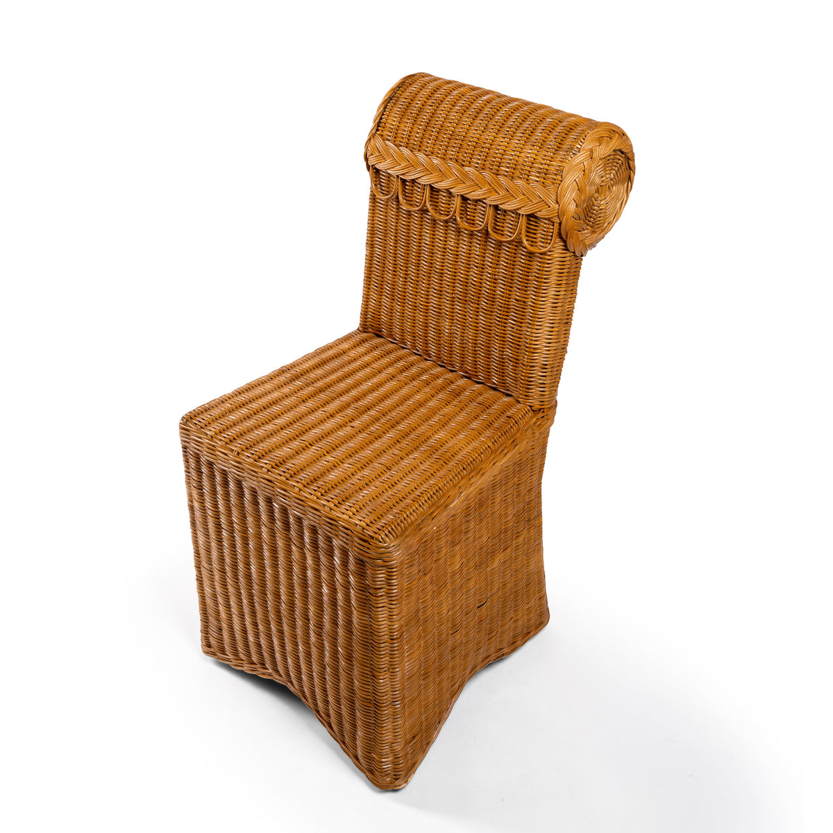 Top Photo of Sharland-England's Letty slipper chair, hand-crafted from 100% natural rattan and featuring undulating lines and feminine silhouette