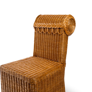Photo of the backrest of Sharland-England's Letty slipper chair, hand-crafted from 100% natural rattan and featuring undulating lines and feminine silhouette