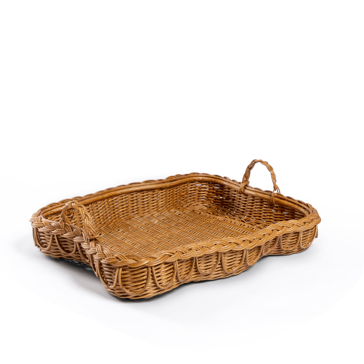 Photo of Sharland-England's Hadley tray Hand-crafted from 100% natural rattan, featuring fixed handles and a beautifully braided, scalloped edge