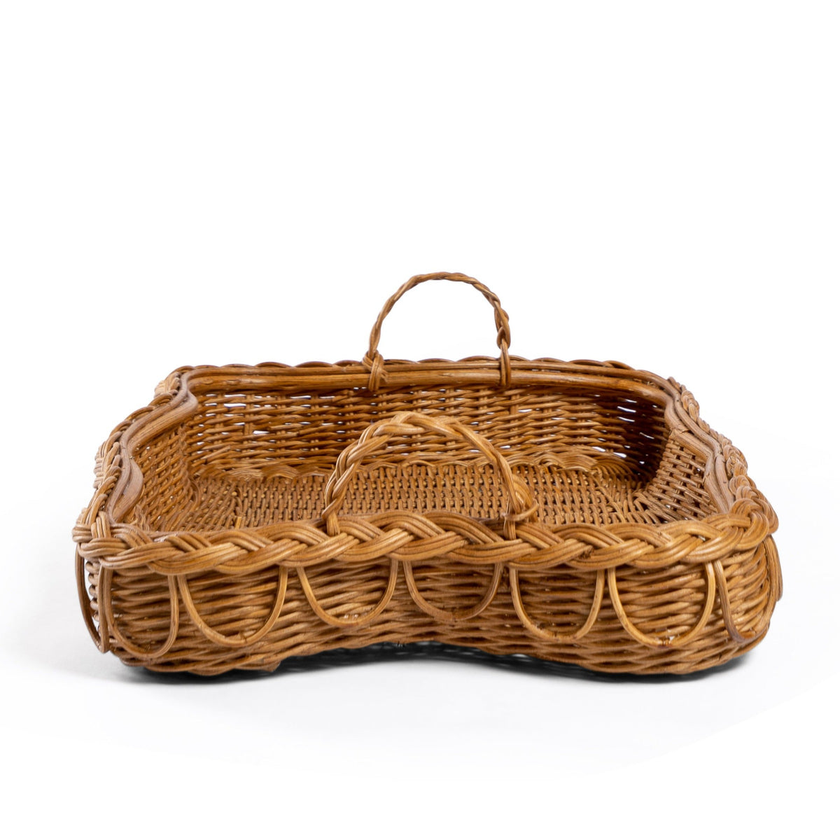 Back side Photo of Sharland-England's Hadley tray Hand-crafted from 100% natural rattan, featuring fixed handles and a beautifully braided, scalloped edge